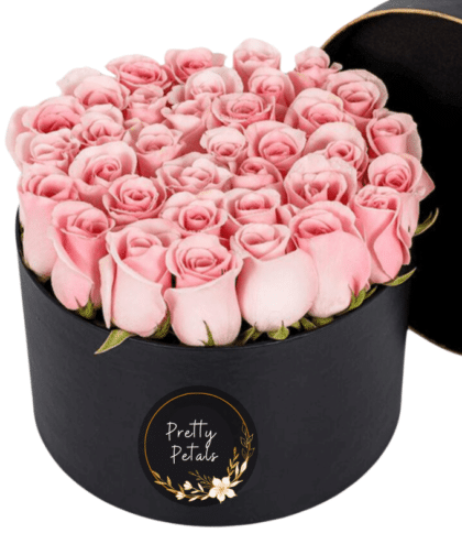 Sweet pink roses in black box arrangement