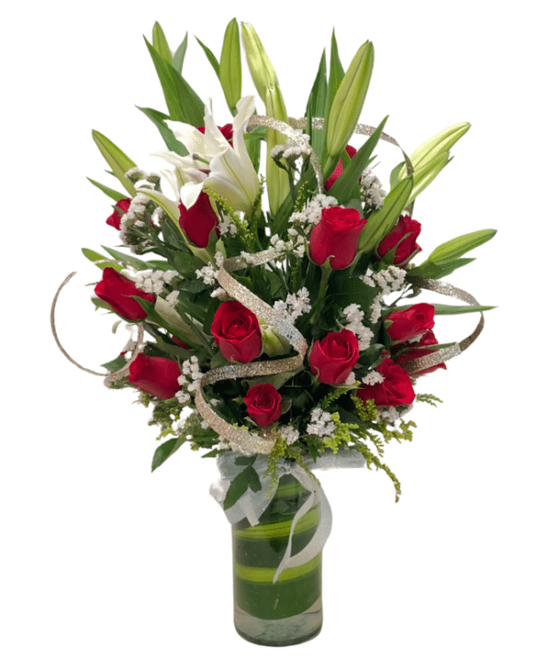white lilies and red roses with silver theme arrangement in vase