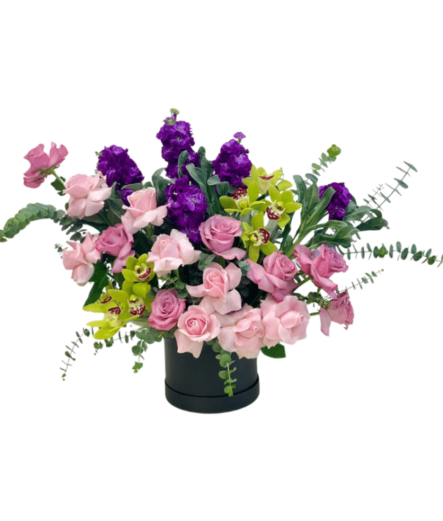 A Green Cymbidium Orchid, Eustoma, and Pink Lavender Roses Floral Box Bouquet