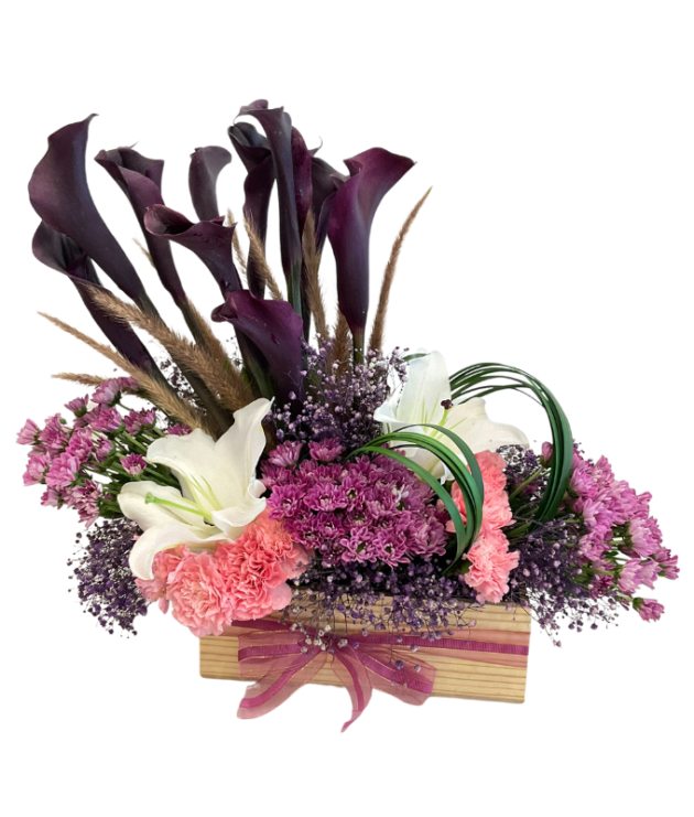 Purple calla lilies,purple chrysanthemums,light pink carnations,white lilies arrangemnt in wooden box