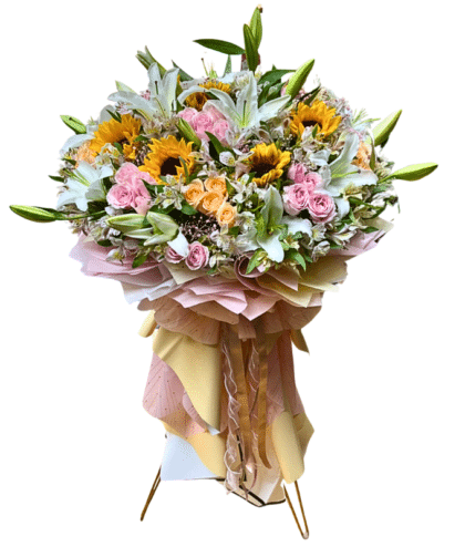 Floral arrangement on golden stand